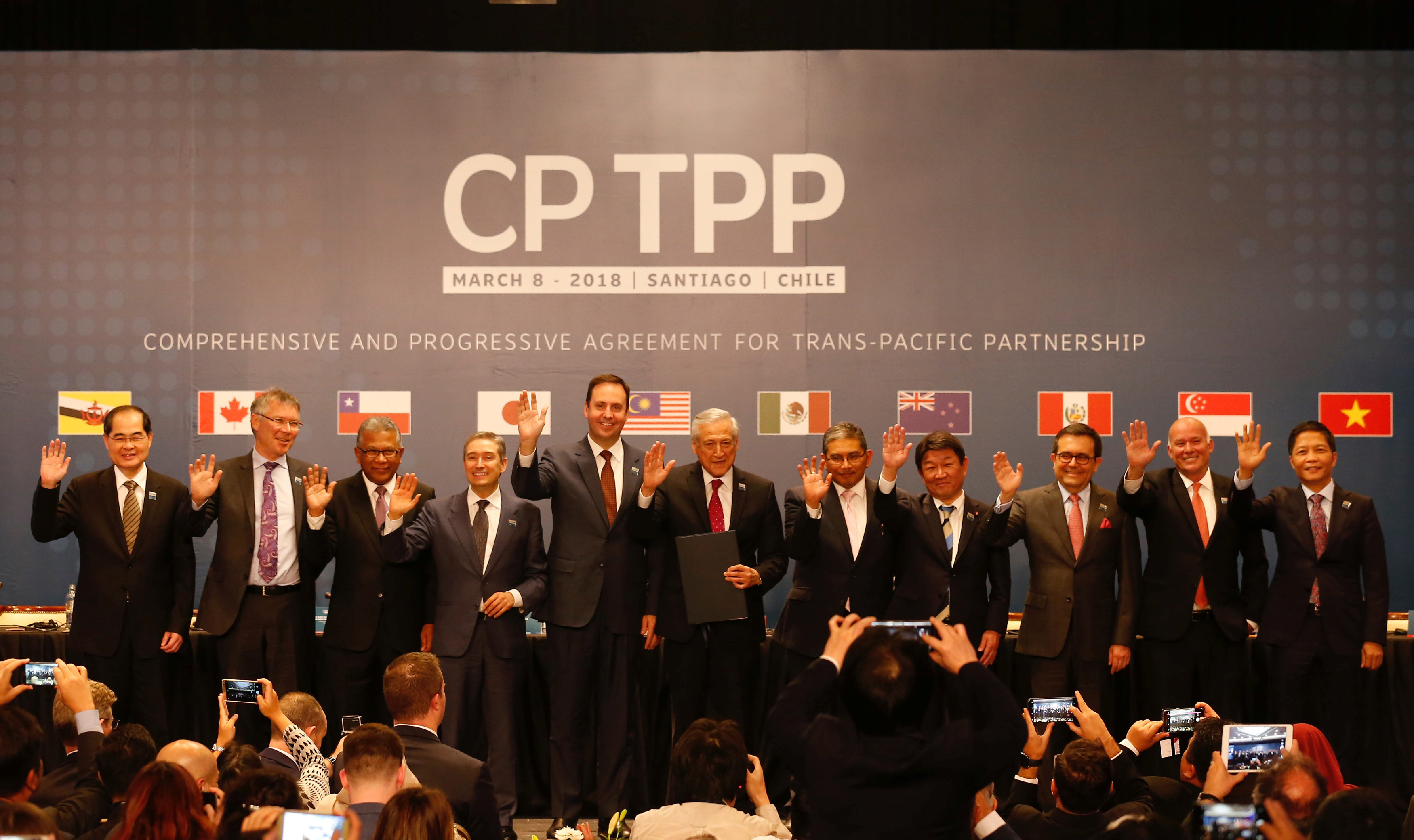 Members of Trans-Pacific Partnership trade deal pose for an official picture after the signing agreement ceremony in Santiago